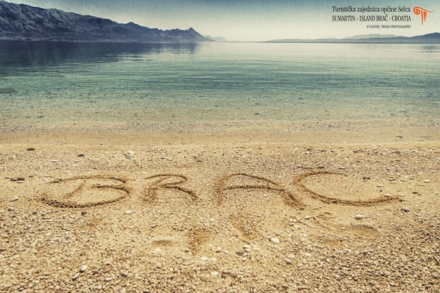 Sandy beach with written island name
