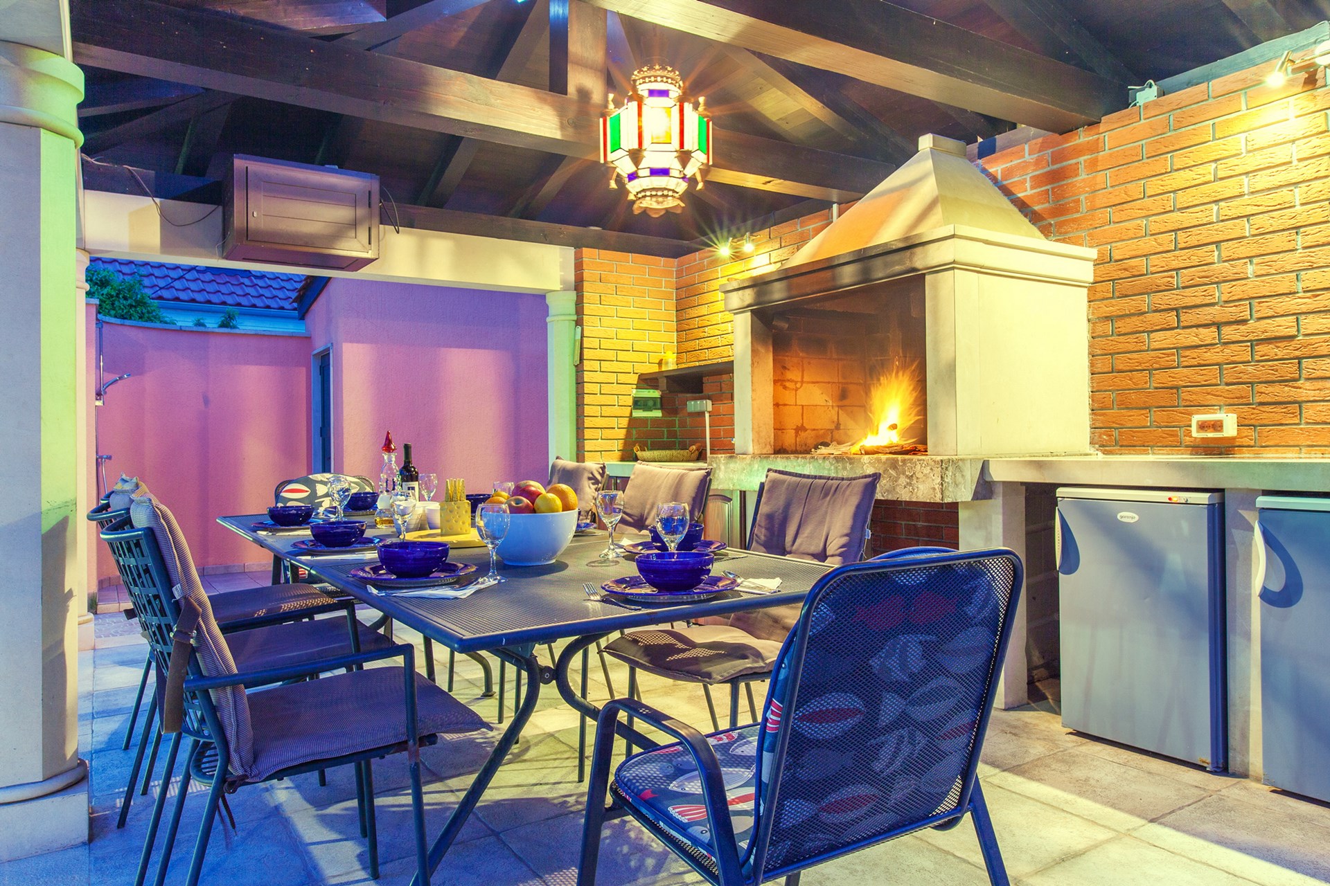 Dinner time at the covered outdoor area with open fireplace